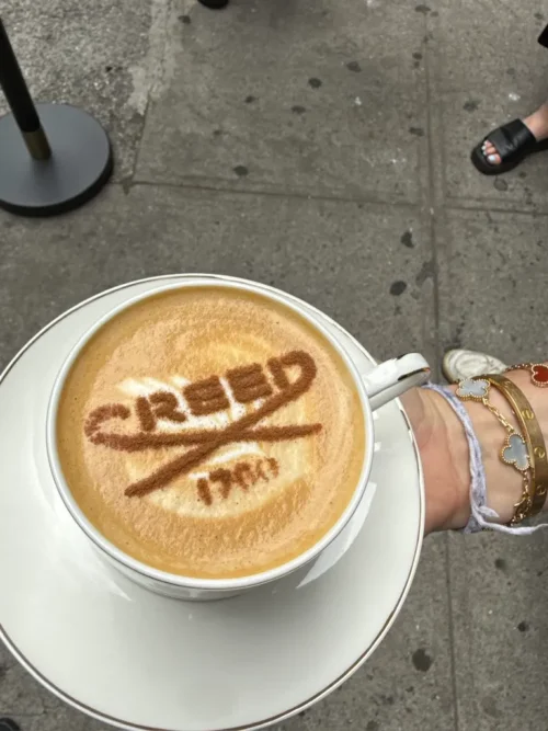 creed logo on coffee